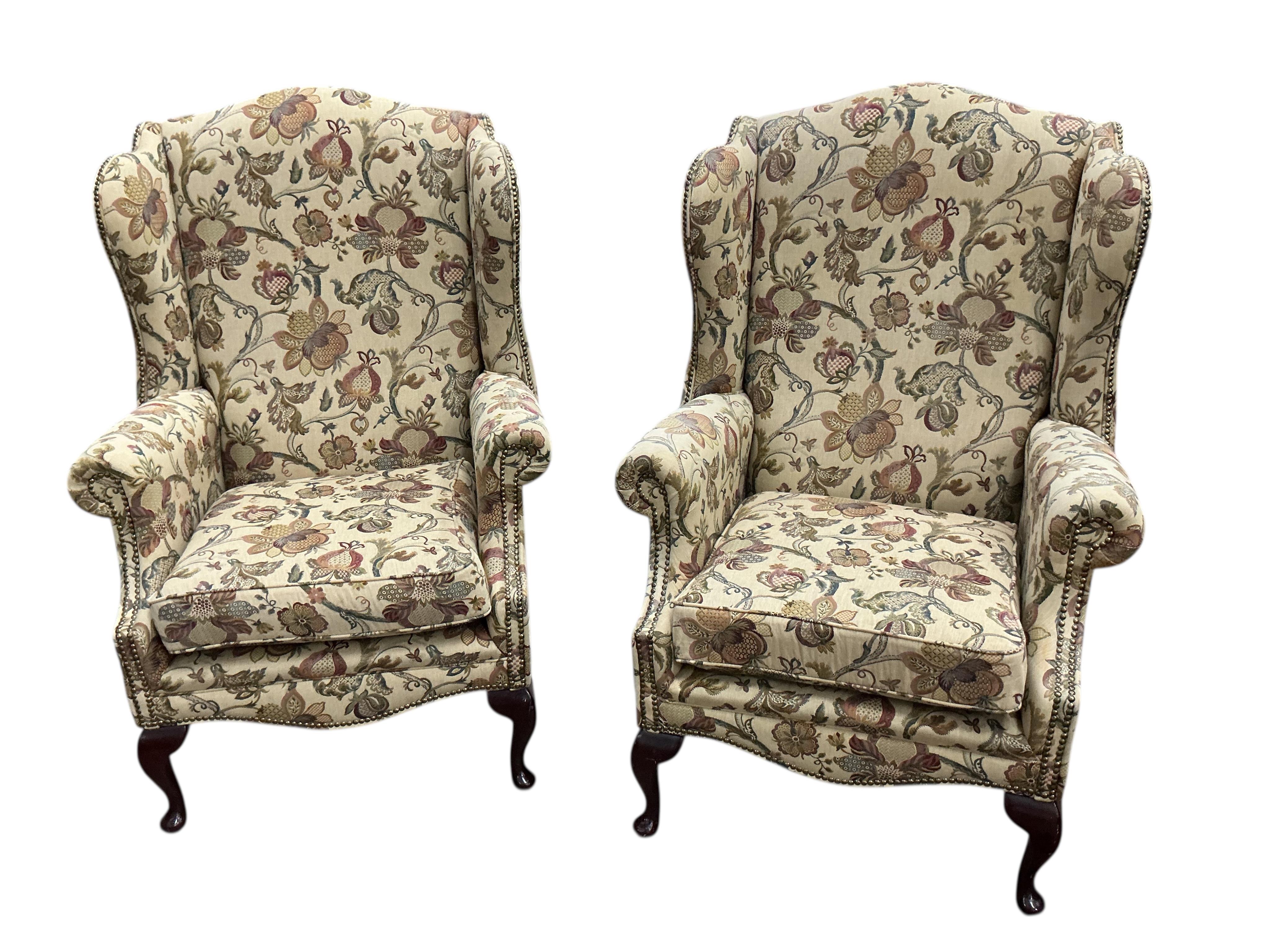 A pair of George III style upholstered wing armchairs, width 80cm, depth 74cm, height 120cm